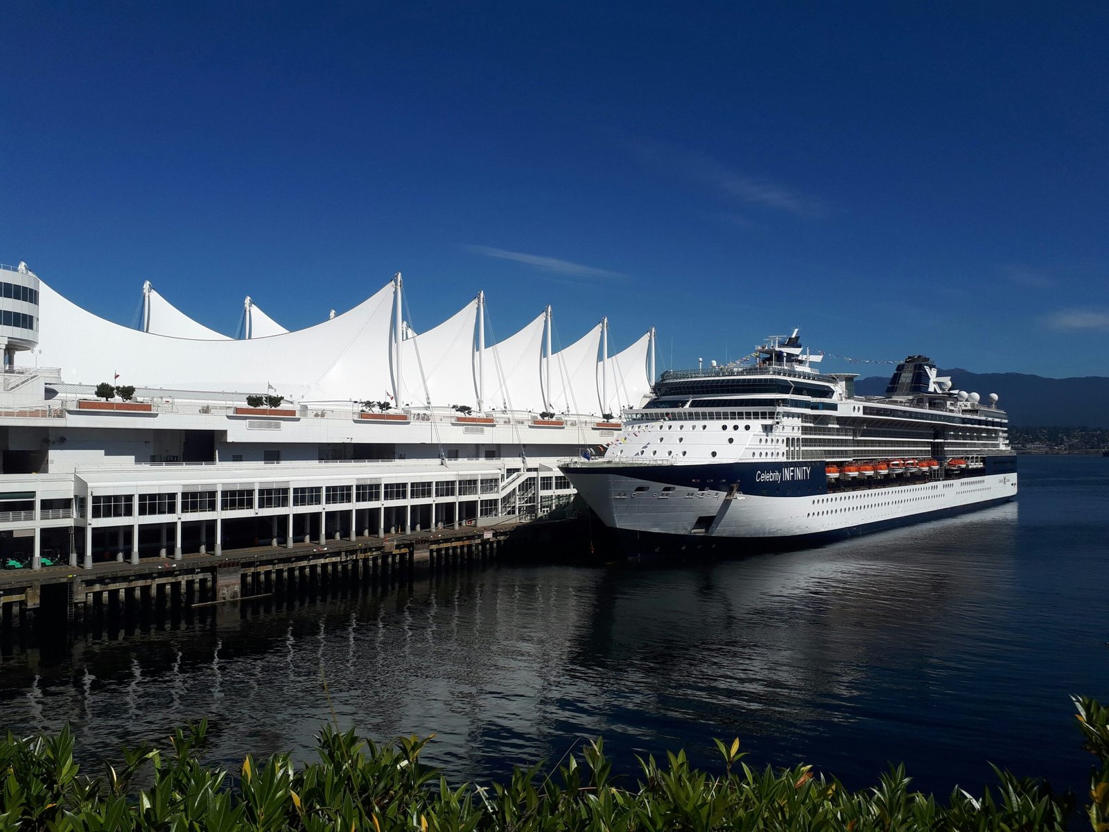 Cruise ship docked at Canada Place, Vancouver, BC. [Photo by Juan Molina on Unsplash]