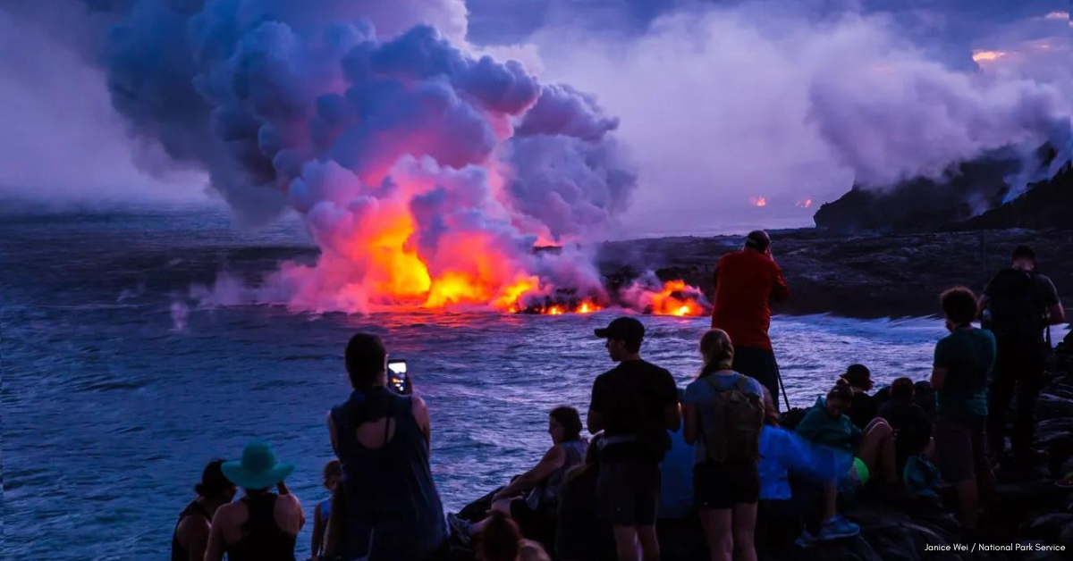 Volcanic landscape with a smoking crater, black lava rock formations, and steam rising in Volcanoes National Park on the Big Island of Hawaii. [Courtesy Janice Wei / National Park Service via USA Today]